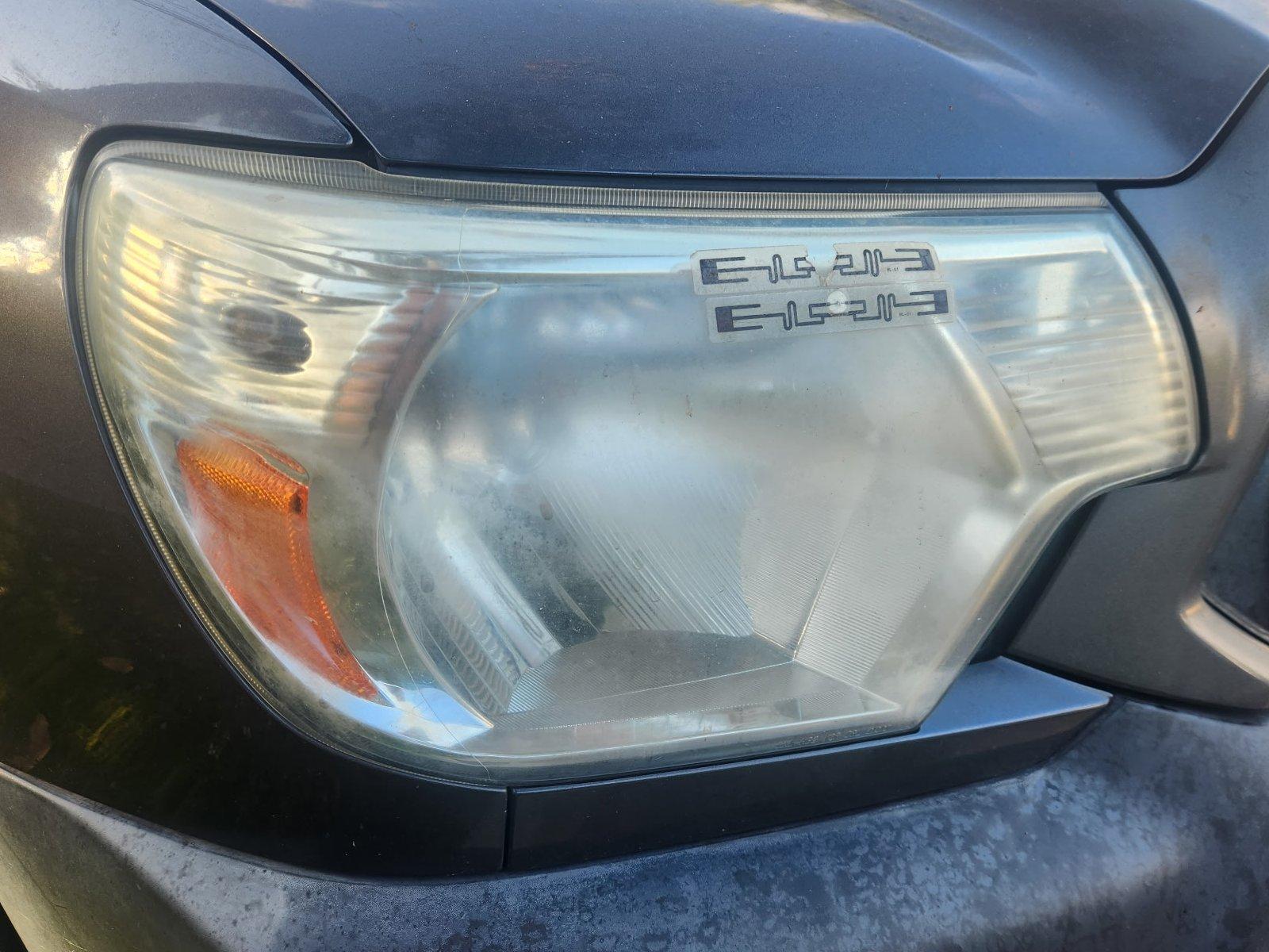 Foggy, yellowed headlight before restoration
