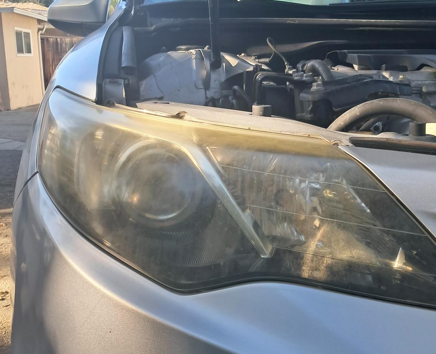 Foggy Toyota Camry headlight before restoration